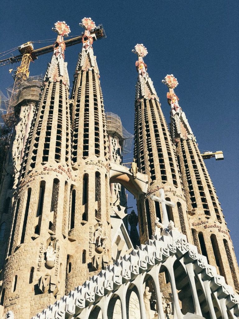 la sagrada familia building under blue sky